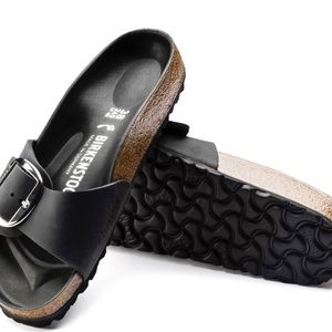 A strap, a buckle and a contoured cork footwear